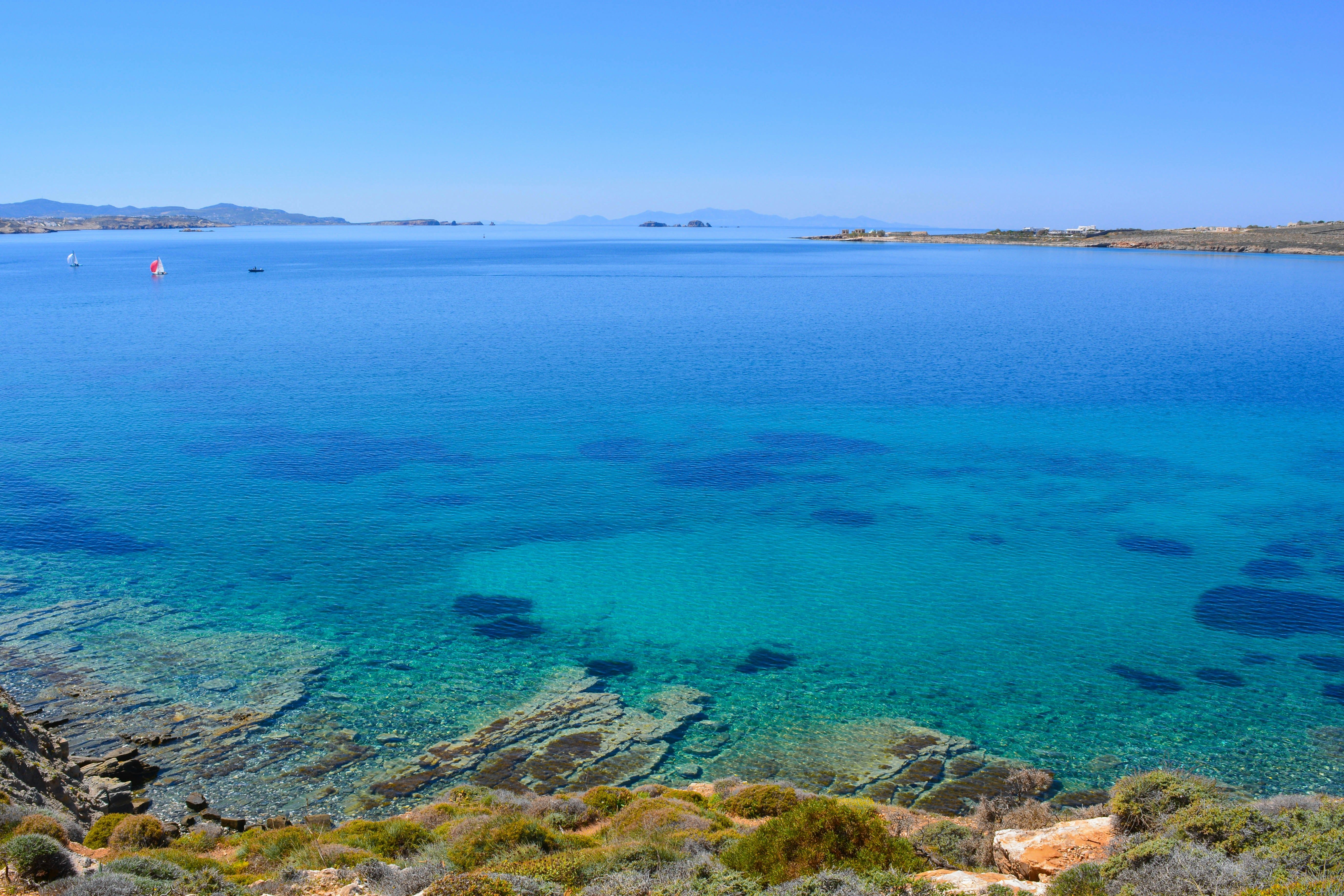 rocky bay with clear blue sea in Paros