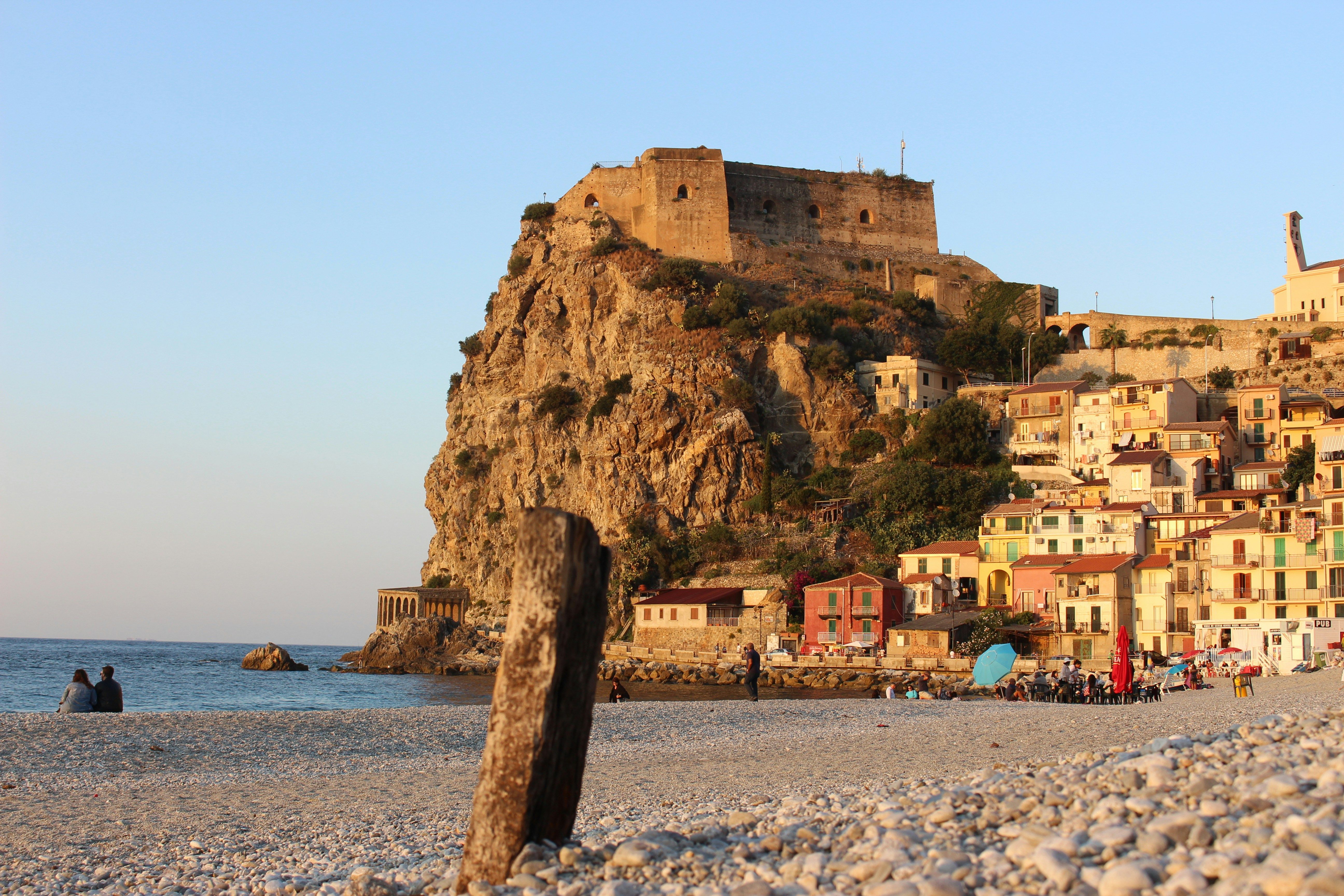 beach in Scilla with cliffside town in the background