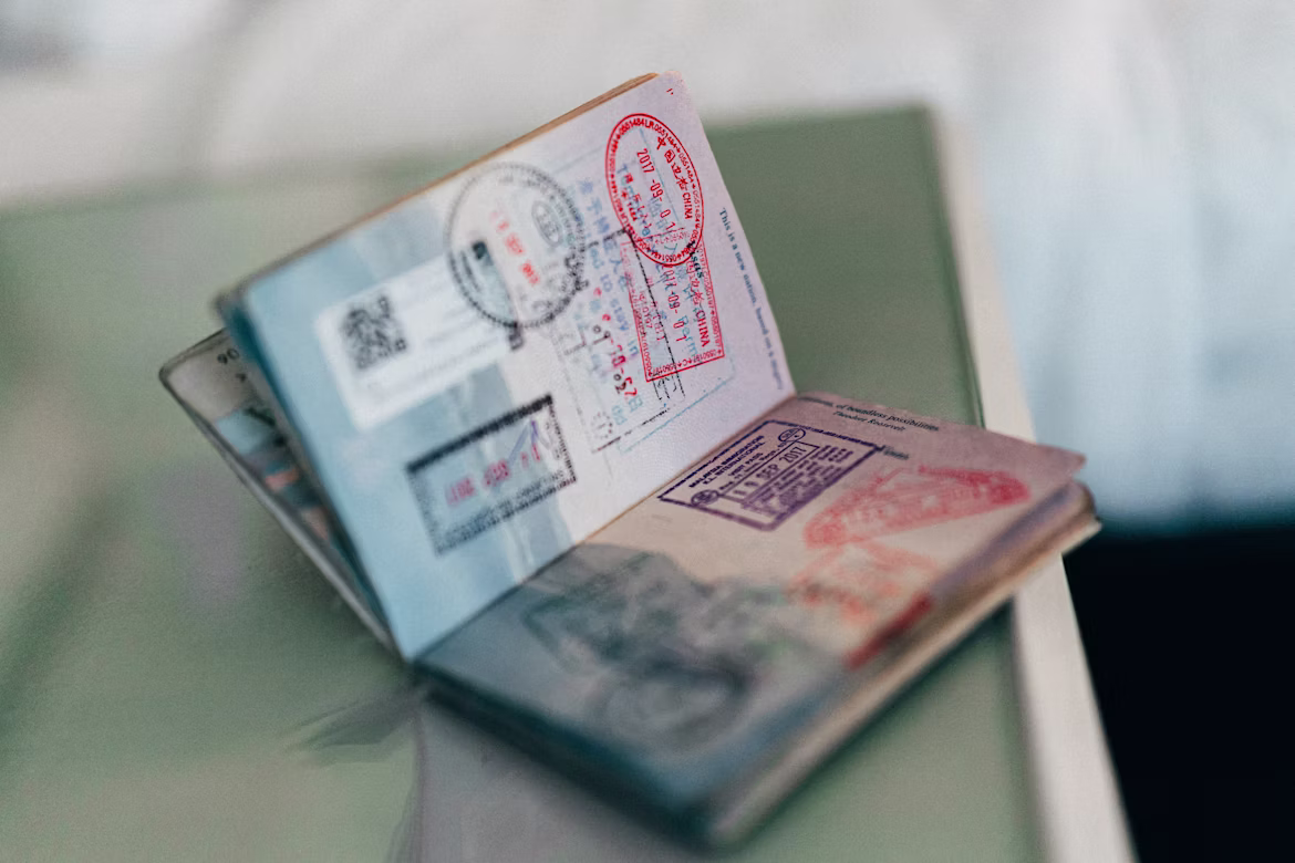 open passport full of stamps