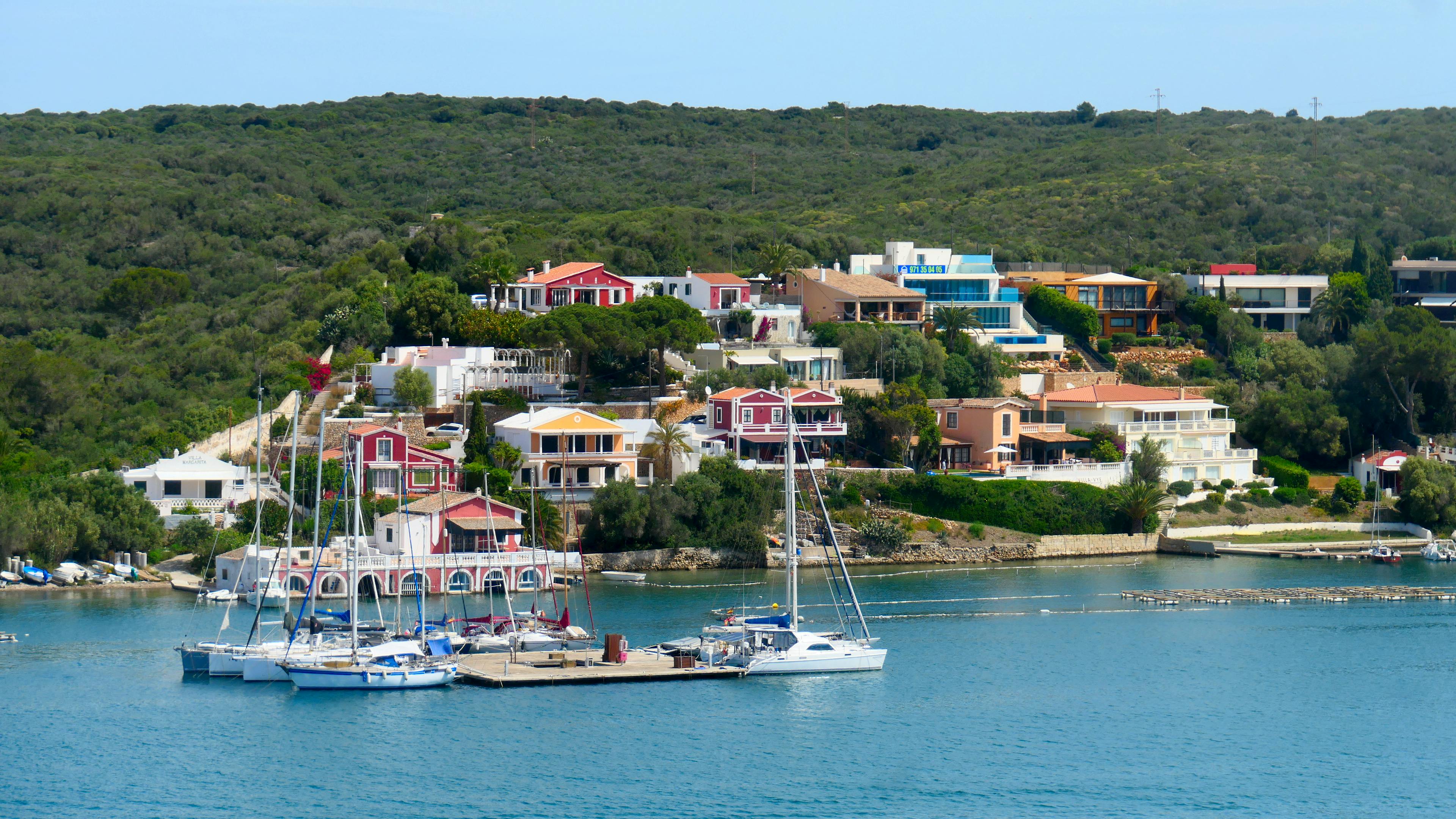 houses in the green hills next to the water in Mahon