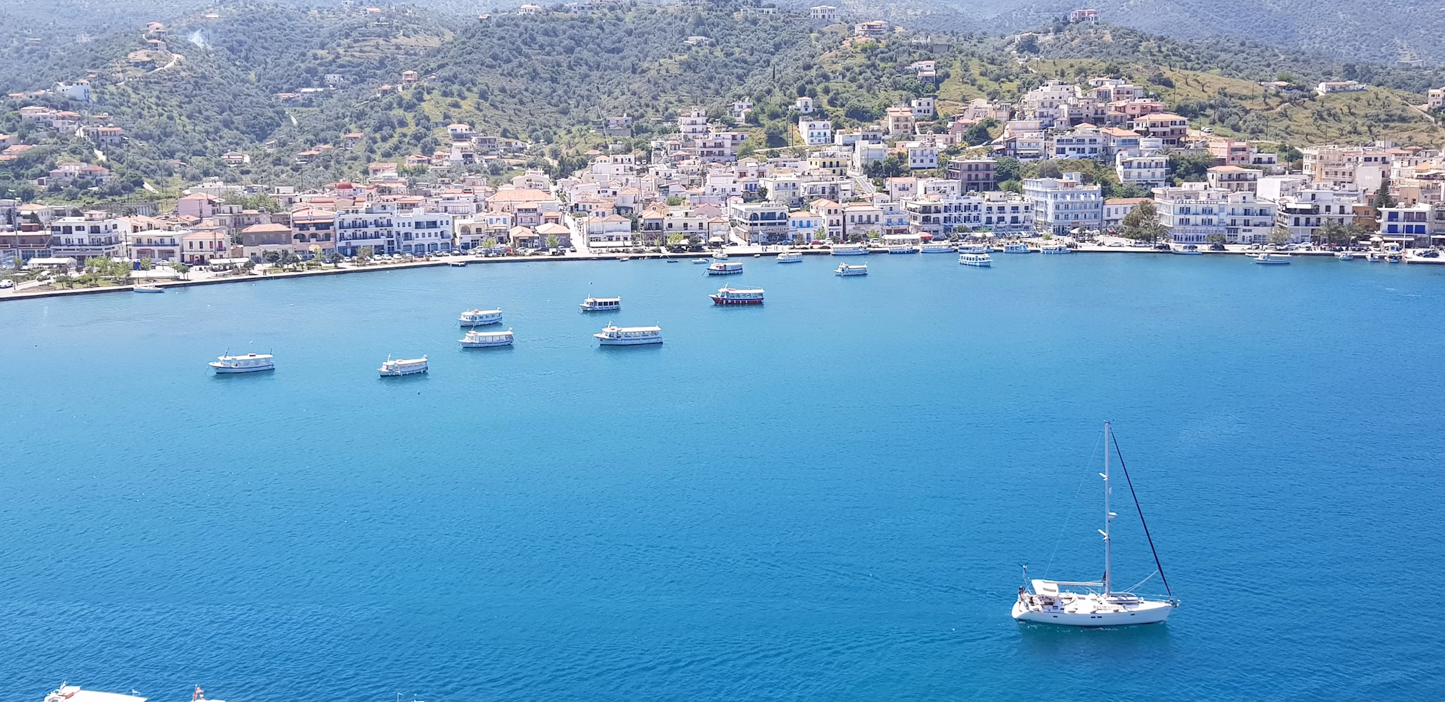 boats in the sea off the coast of Poros