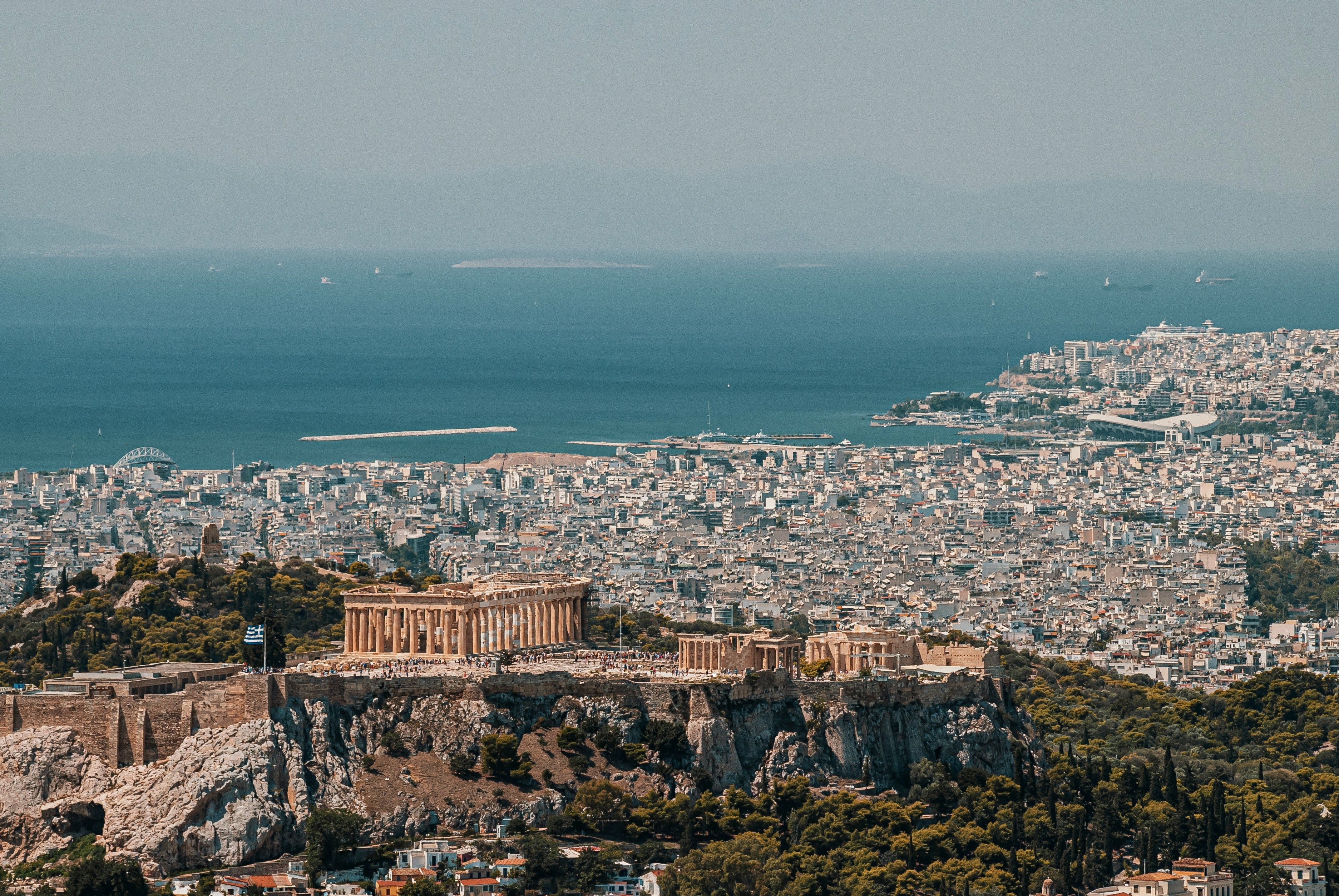 view over the city of Athens with the sea in the background