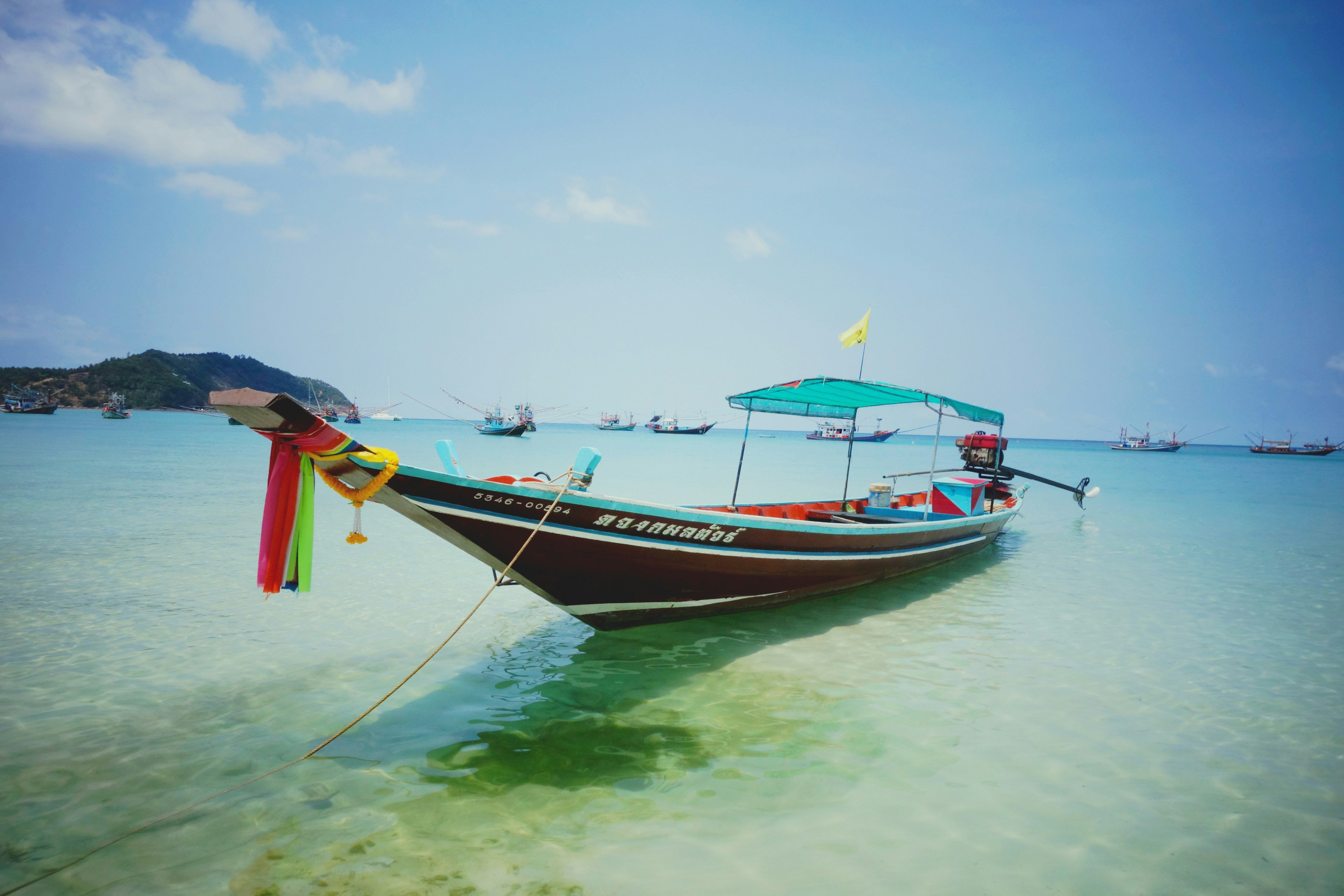 long-tail boat in the sea off the coast of Koh Phangan