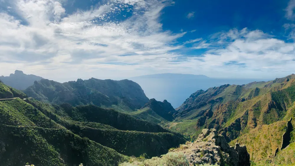 rugged mountains in Tenerife with hazy blue skies