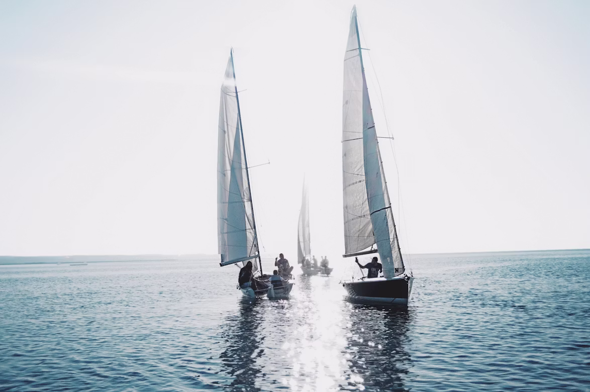 sailing boats drifting along at sea
