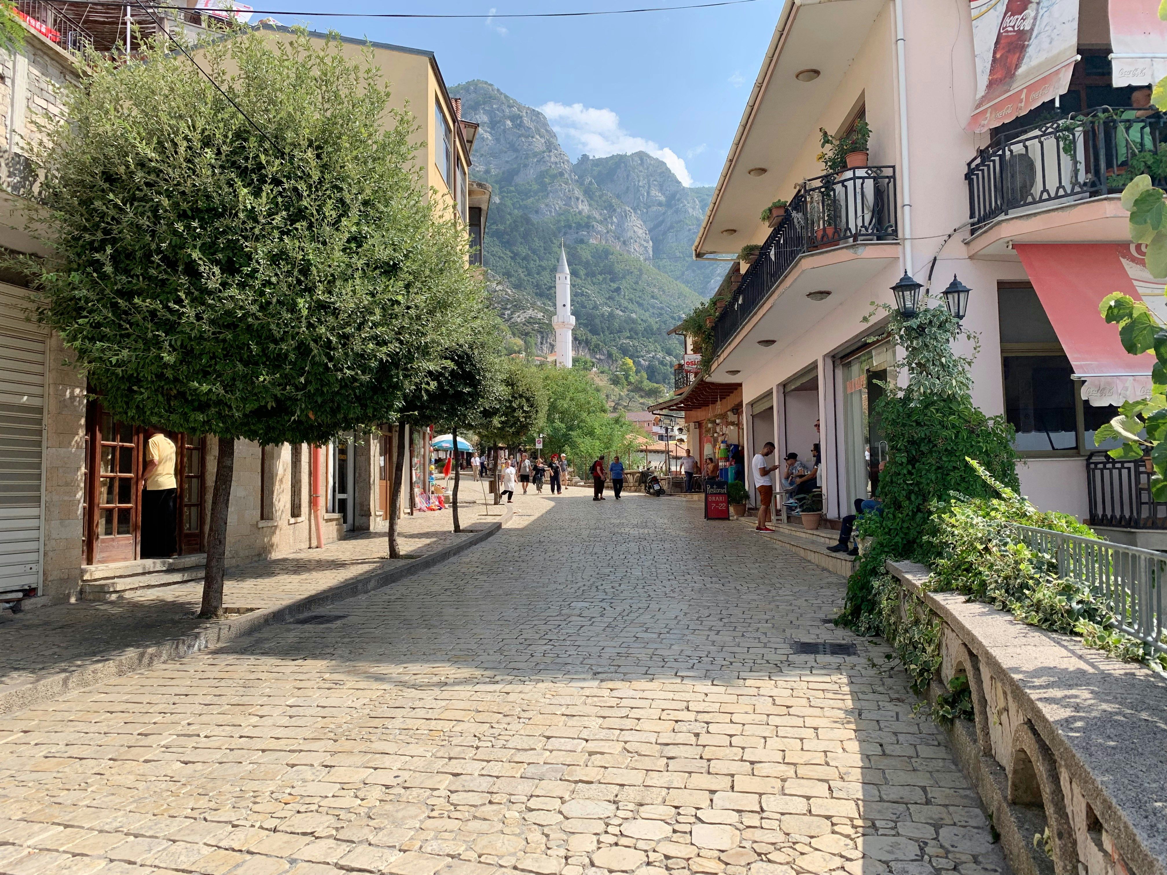 cobbled street in Durres with mountains behind