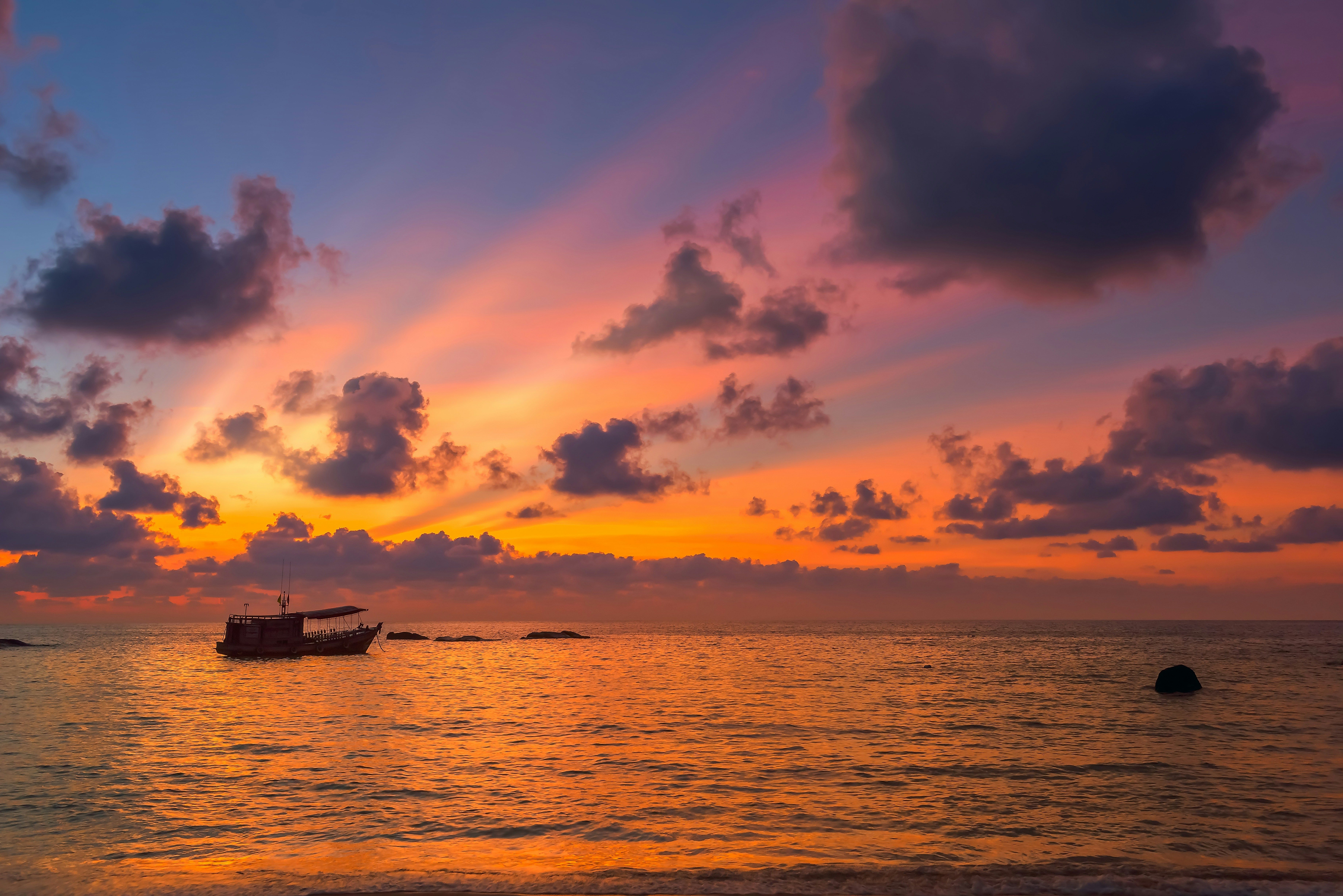 boat in the sea in Koh Tao at sunset