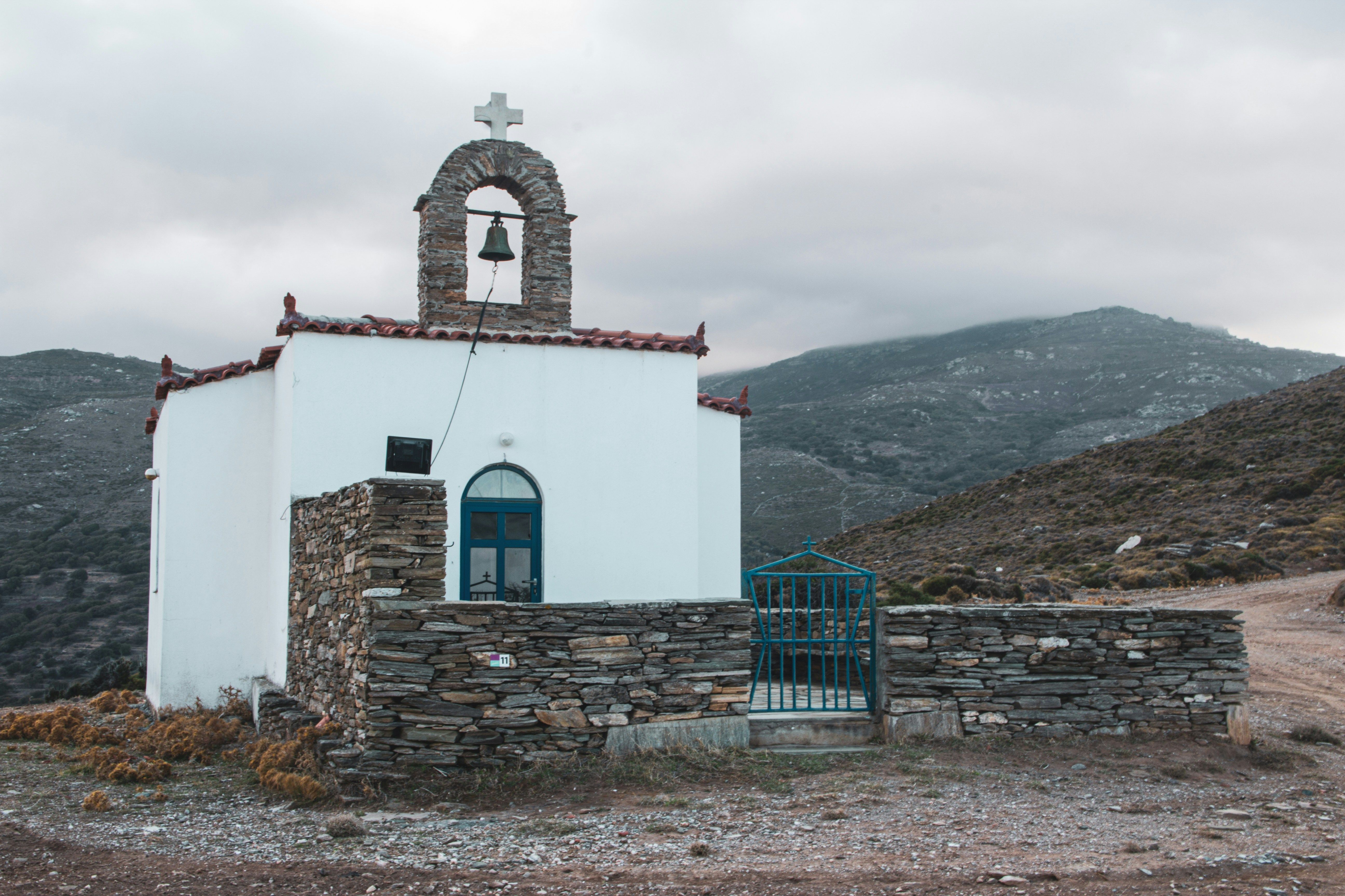 small white church in the mountains in Andros